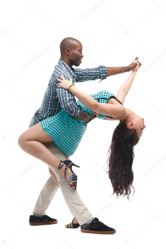Black man and caucasian woman in casual clothes in incendiary dance isolated on white background.