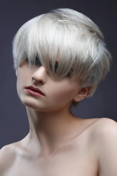 Beauty portrait of blonde woman with stylish short haircut.
