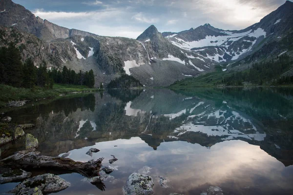 Morning landscape with mountains reflecting in the lake, Altai.