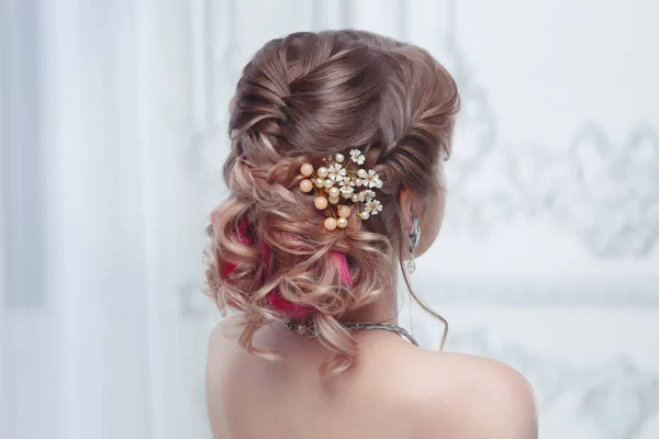 Beautiful air wedding hairstyle view from the back.