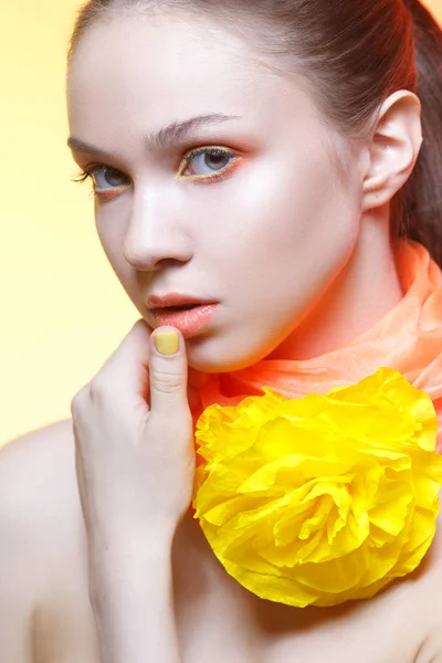 Close up portrait of young woman with colorful makeup