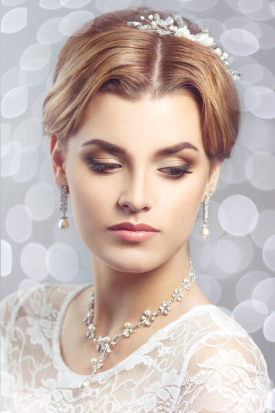 Portrait of elegant bride with make up and hairstyle
