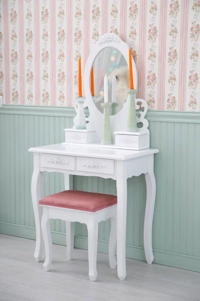 Beautiful wooden dressing table with mirror on white background wallpaper.