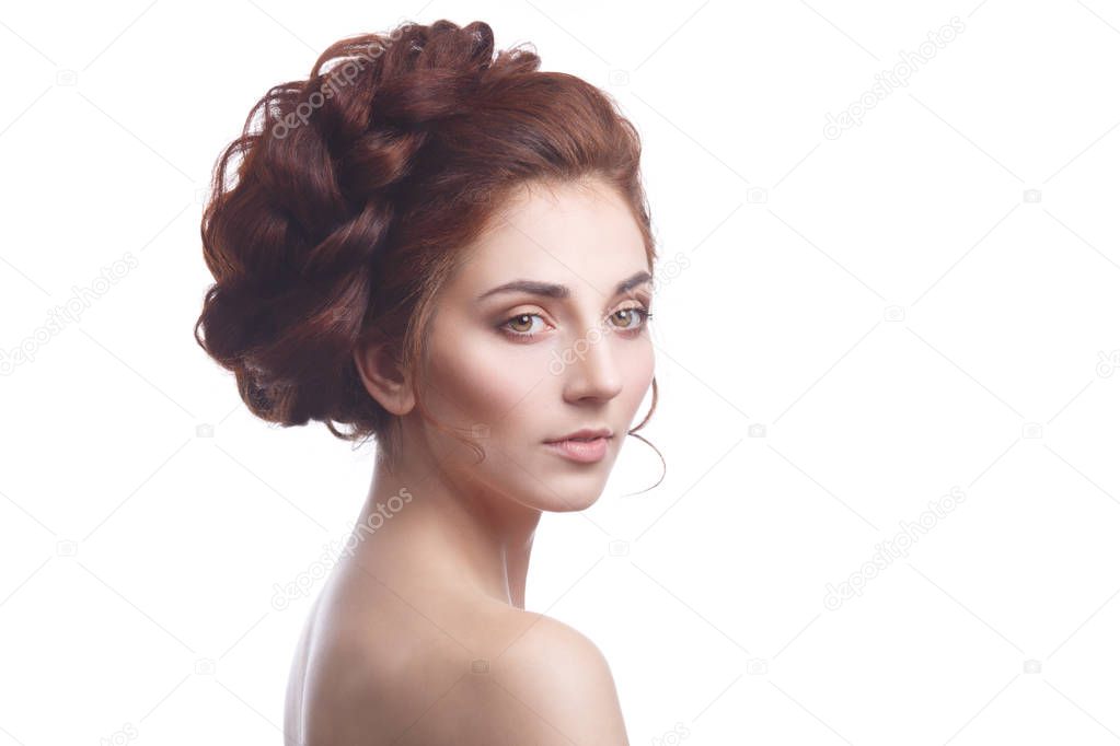 Beauty portrait of an elegant girl with a beautiful hairstyle isolated on a white background.