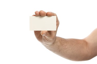 Male hand is holding a blank business card isolated on white background.