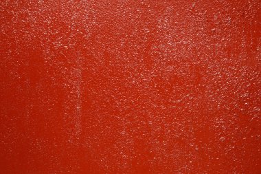 Desensel arkaplan kırmızı boyalı yüzey.