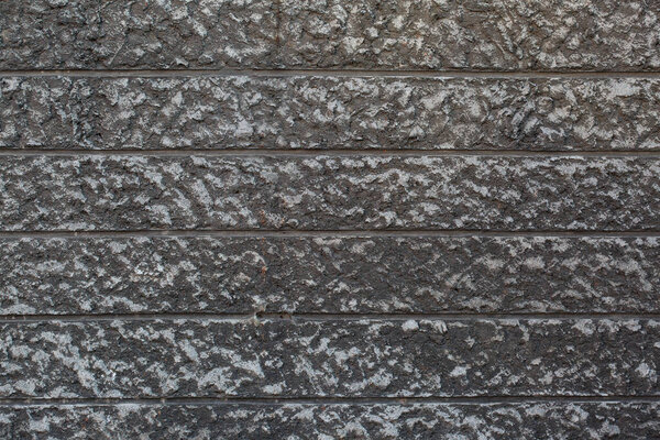 Текстурный фон из серой крупнозернистой штукатурки, украшенной для кладки
.