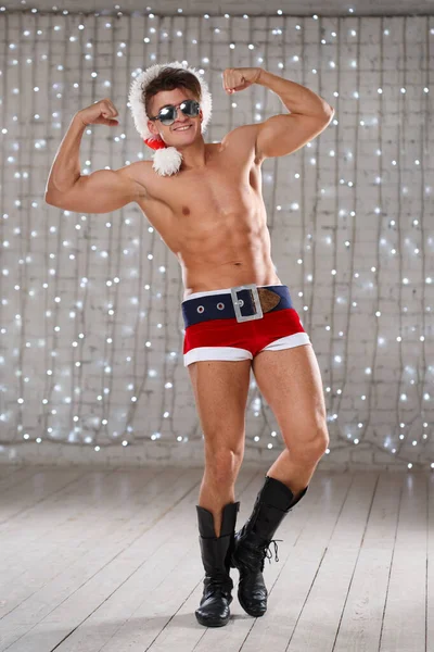 Athletic Muscular Young Guy Bad Santa Sexy Costume — Stock Photo, Image