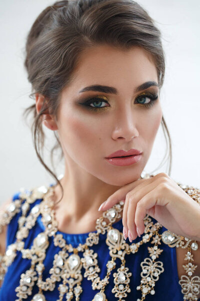 Beauty portrait of an elegant woman in a chic necklace.