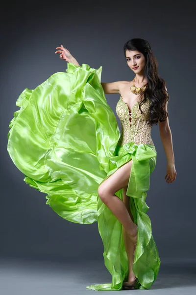 Beautiful Long Haired Brunette Flowing Green Dress Dark Background Full — Stock Photo, Image
