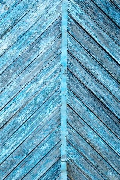 Blue color old wooden diagonal symmetrical planks with peeled paint background — Stock Photo, Image