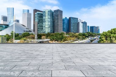 Blue sky, empty marble floor and skyline of Hangzhou urban archi clipart