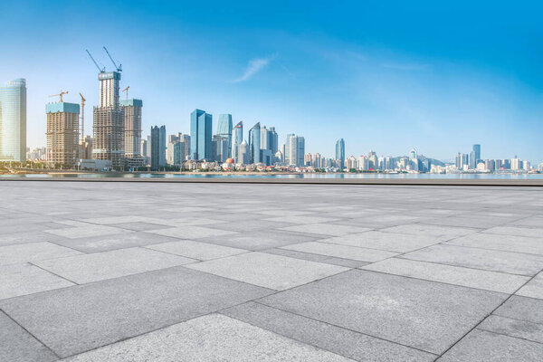 The empty marble floors and the skyline of Qingdao's urban build