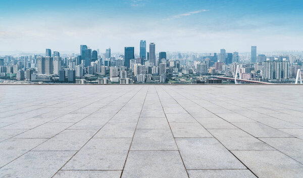 Urban skyscrapers with empty square floor tiles