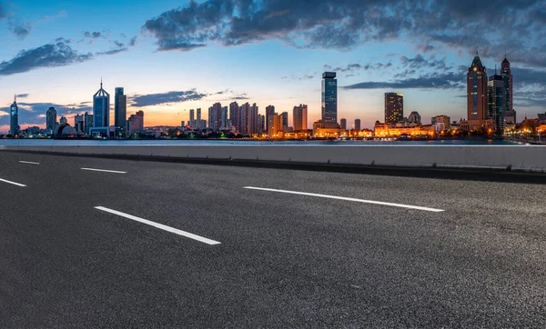 City skyscrapers and road asphalt pavement