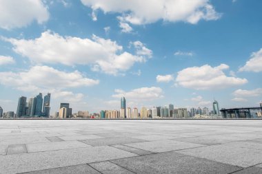 Empty marble floors and city views under the blue sky clipart