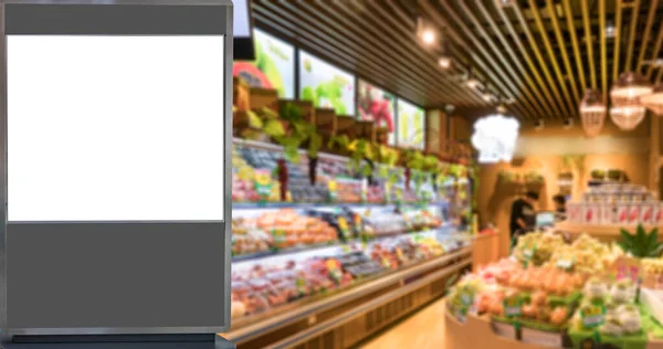 Het Reclamelampenkastje Het Wazige Supermarktinterieur — Stockfoto