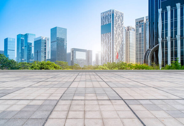 Urban skyscrapers with empty square floor tiles