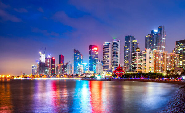 Night view of modern urban architecture landscape in Qingda