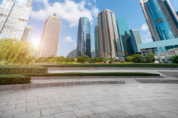Puty square floor tiles and skyline of modern urban buildings i

