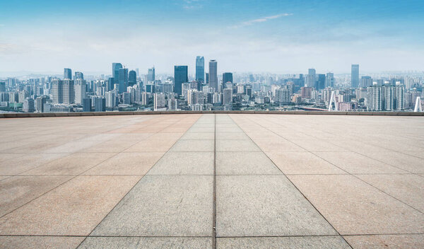 Urban skyscrapers with empty square floor tiles