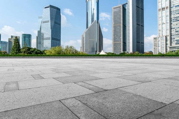 Puty square floor tiles and skyline of modern urban buildings i
