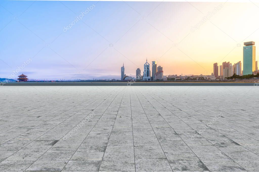 Empty square floor tiles and urban architectural landscape