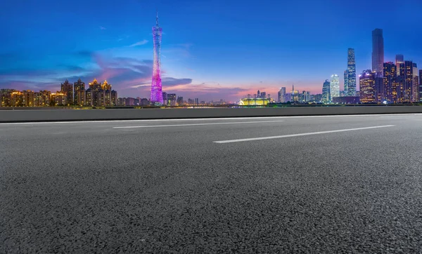 City skyscrapers and road asphalt pavement