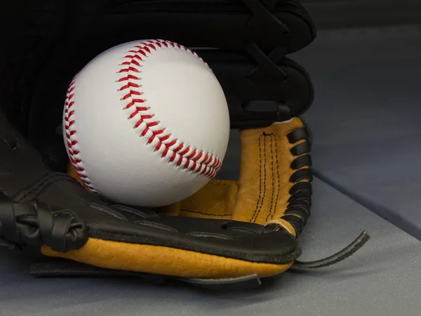 Close-up baseball with red seams, stitched leather, red threads, with room for copy