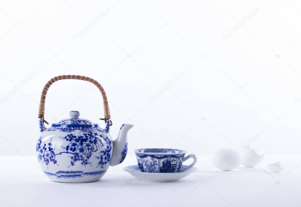 Traditional pottery products for tea of Vietnam on white background with copy space.