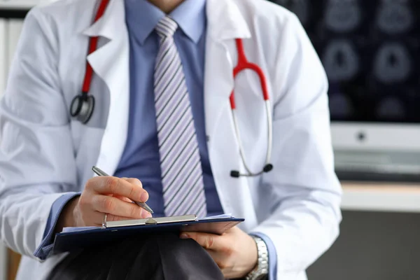 Male medicine doctor hand holding silver pen writing — Stock Photo, Image