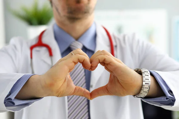 Male medicine doctor hands showing heart shape — Stock Photo, Image