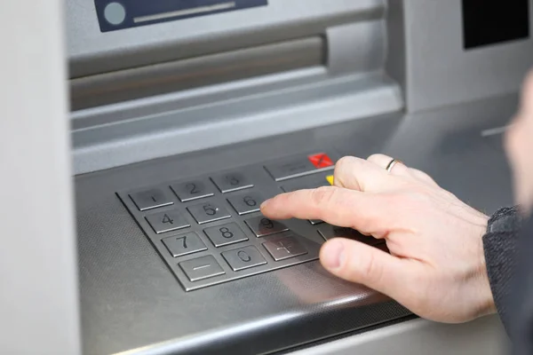 Closeup male hand dials pin code on terminal — Stock Photo, Image