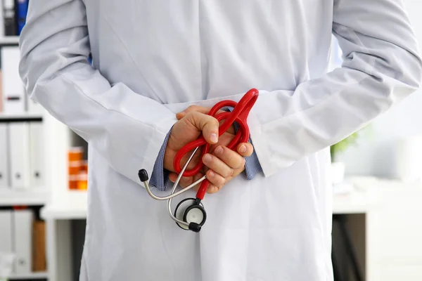 Doctor hands with stethoscope behind his back — Stock Photo, Image