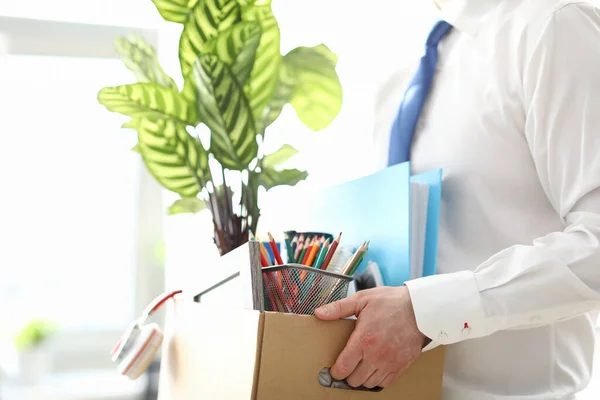 Fired man carrying box with personal belongings — Stock Photo, Image