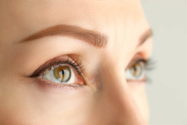 Close-up face of a woman with a permanent eyebrow — Stock Photo, Image