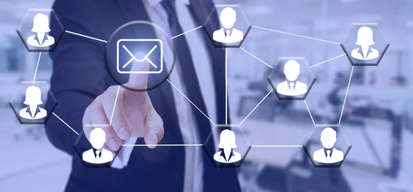businessman touch mail icon sending all staff on transparent screen