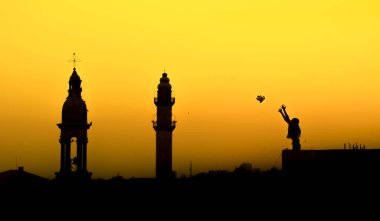 of woman flying a peace dove. Mardin mosque and church together clipart