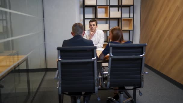 Family with realtor in boardroom discussing about mortgage contract. — 비디오