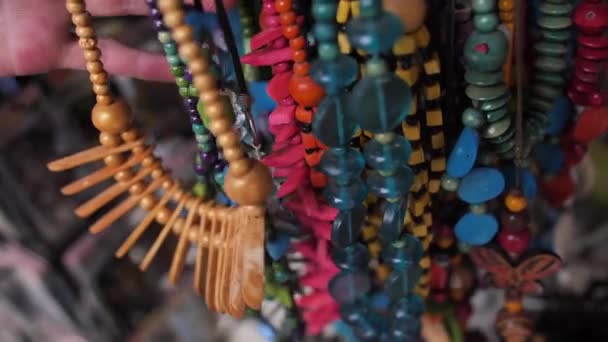 A lot of beads in different colors are selling on the outdoor fair — Stock Video