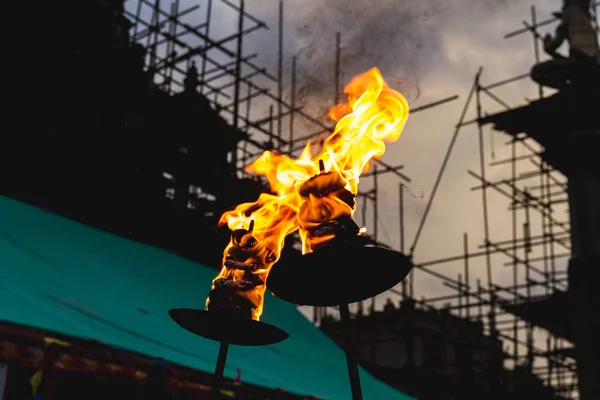 Fire Flames from oil lamps  burnt during the festival in  the temple premises.