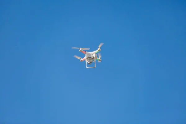 Drone flying in the sky with a mounted digital camera to take photos and videos. Flying Drone.