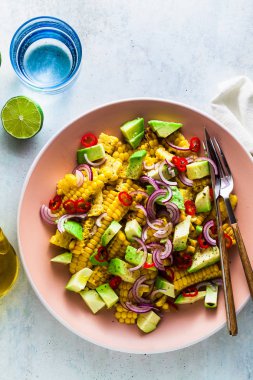 grilled corn , avocado salad with blue onion and chili pepper. healthy summer breakfast or lunch clipart