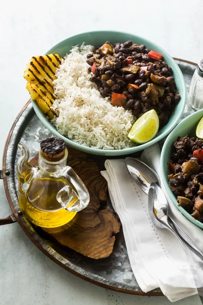 Cuban rice and black bean dish with grilled pineapple. Healthy Vegan Caribbean food for the whole family, party or restaurant menu