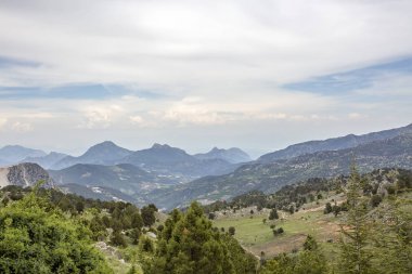 beautiful landscape with mountains, blue cloudy spring day