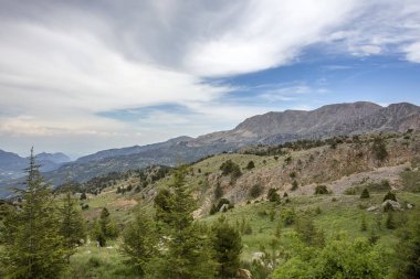 beautiful landscape with mountains, blue cloudy spring day