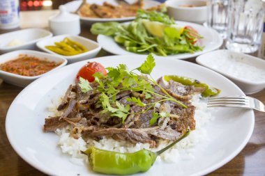 rice with meat and parsley on the plate