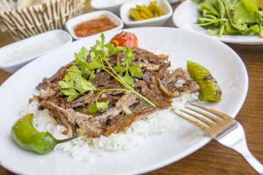 rice with meat and parsley on the plate