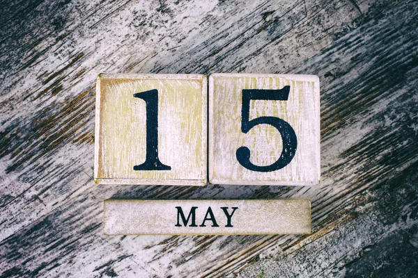 wooden calendar with date may, 15