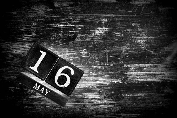 wooden calendar with date may, 16
